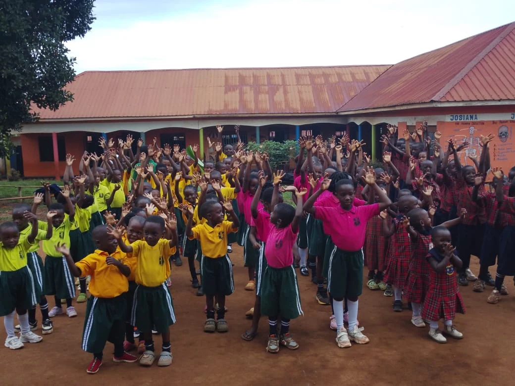 Children taking part in a group activity in the school compound