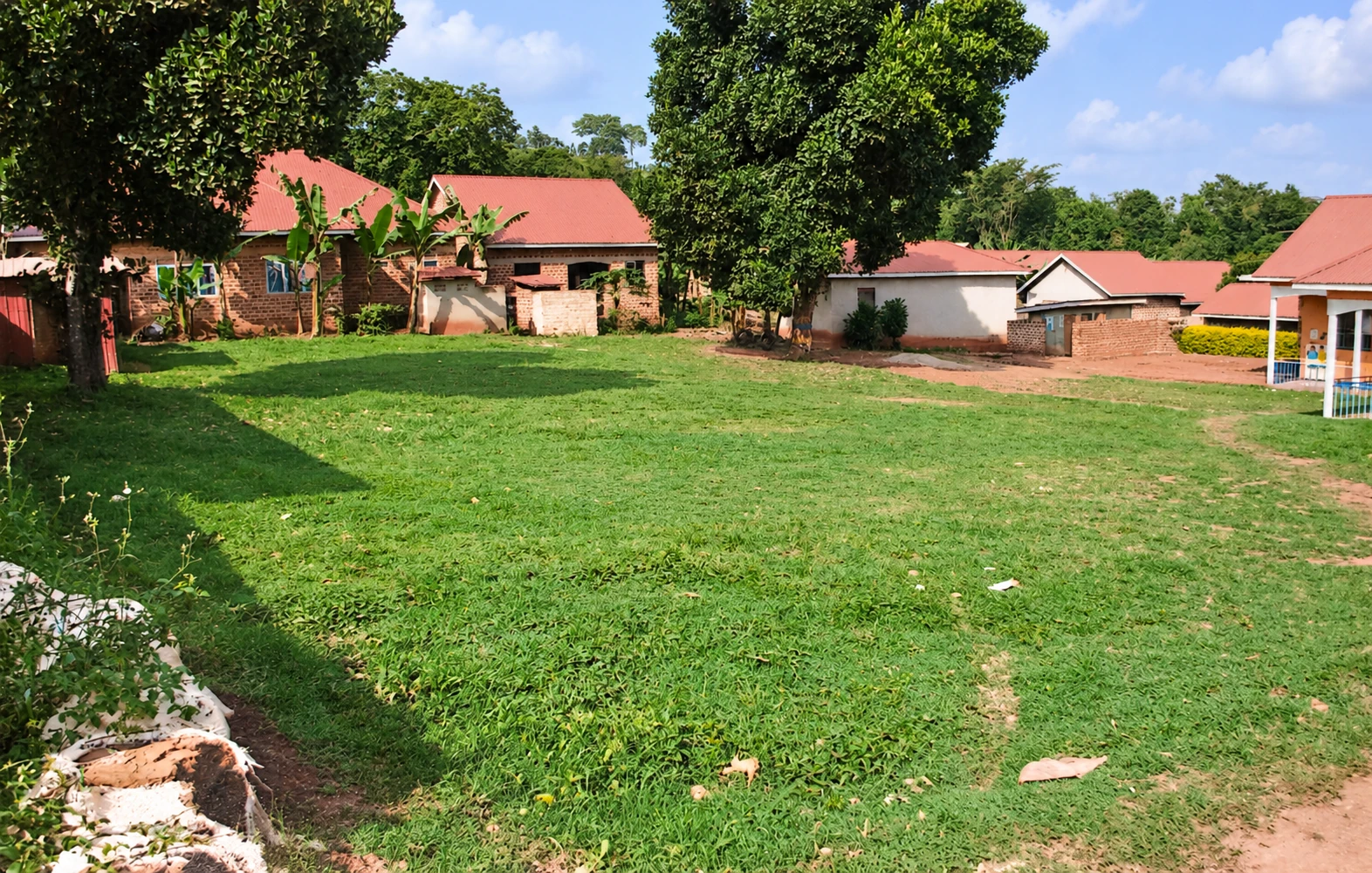 School buildings facing an open grassy area