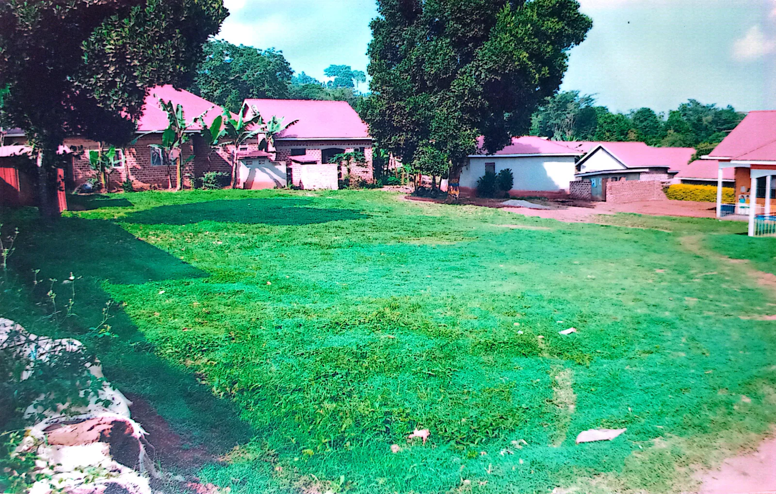 School buildings facing an open grassy area